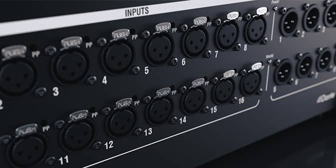 A closeup of the many male and female XLR I/O connections on a dLive control surface.